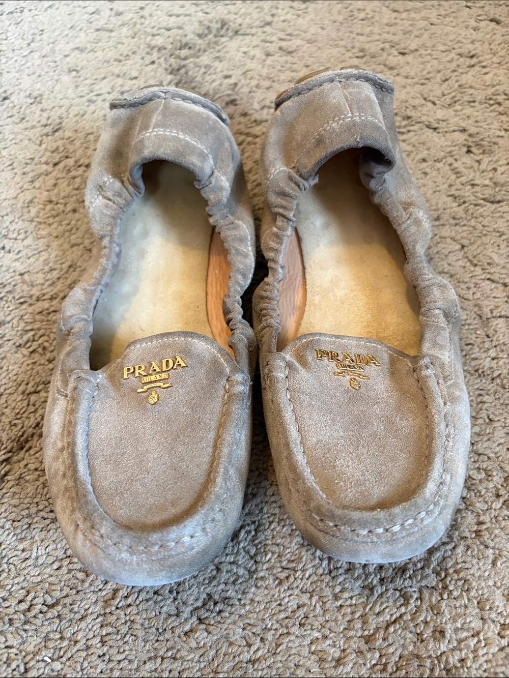 Prada Taupe Suede Slip-On Loafers with Gold Logo